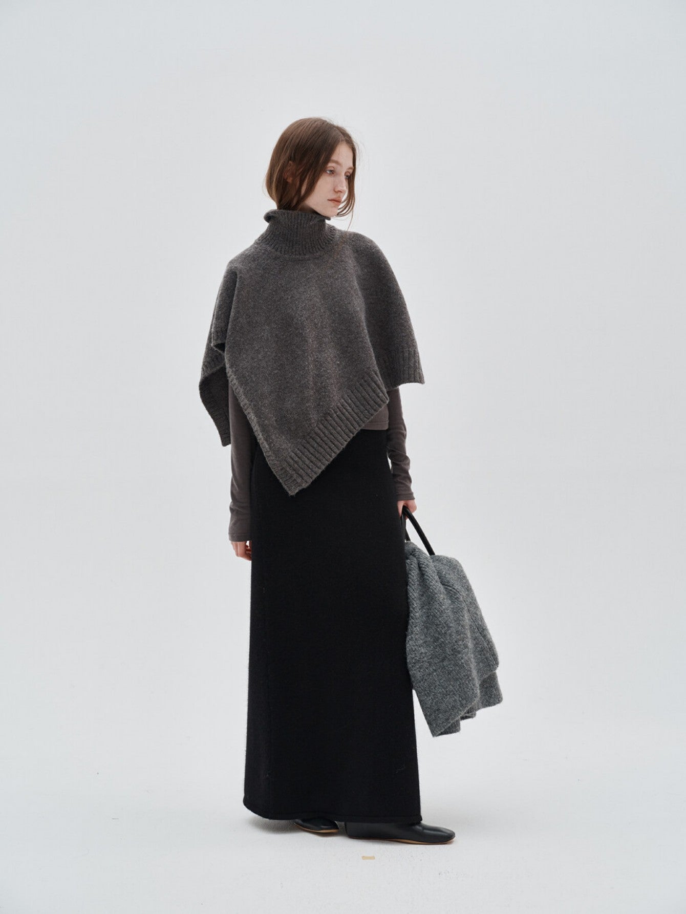 Eliraya unique asymmetrical knit cape for women, a winter cardigan shawl that adds warmth and an elegant touch to any outfit.