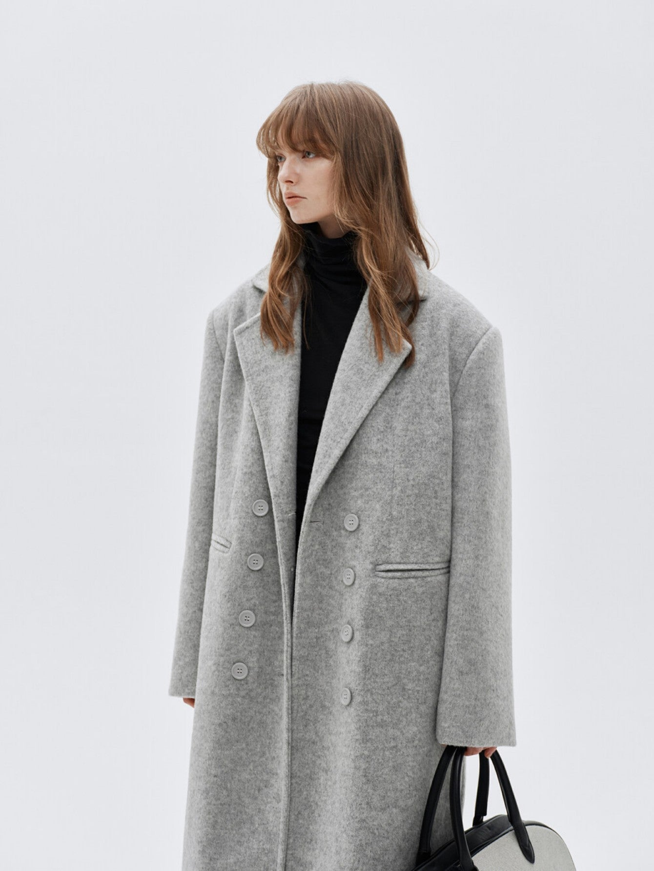 Eliraya double-breasted wool coat for women, featuring a gray long-line design for a classic, tailored winter overcoat look.