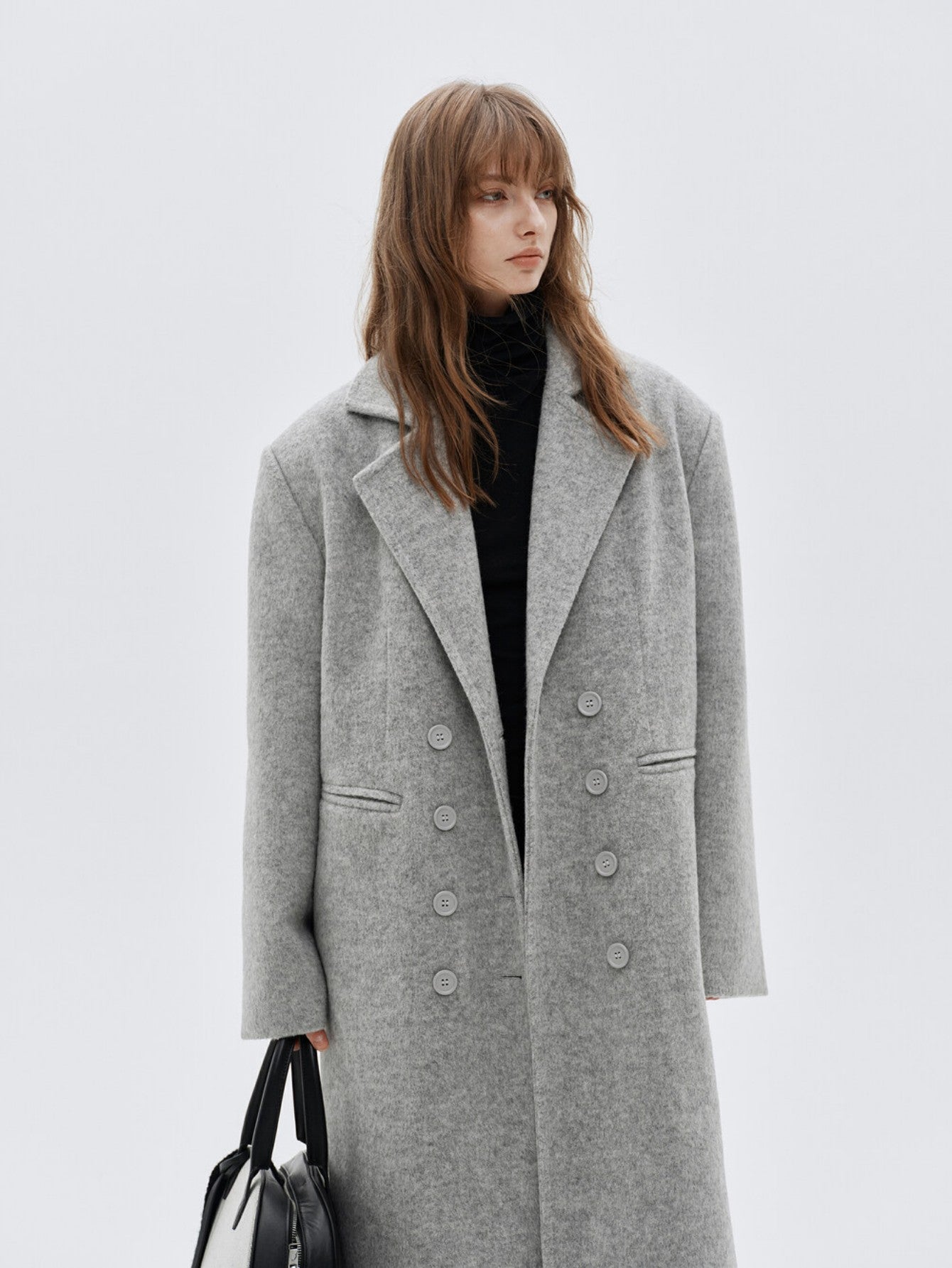 Eliraya double-breasted wool coat for women, featuring a gray long-line design for a classic, tailored winter overcoat look.