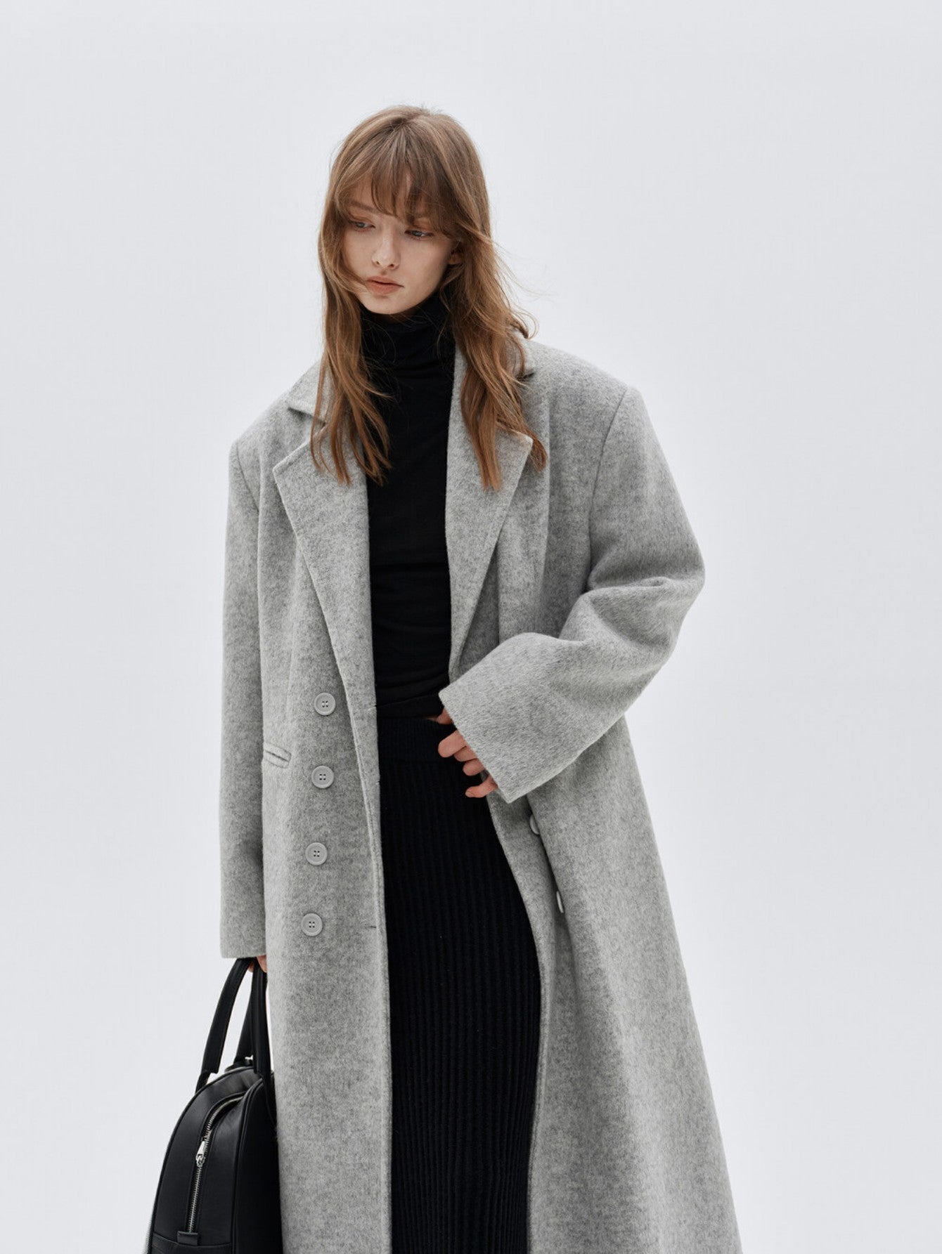 Eliraya double-breasted wool coat for women, featuring a gray long-line design for a classic, tailored winter overcoat look.