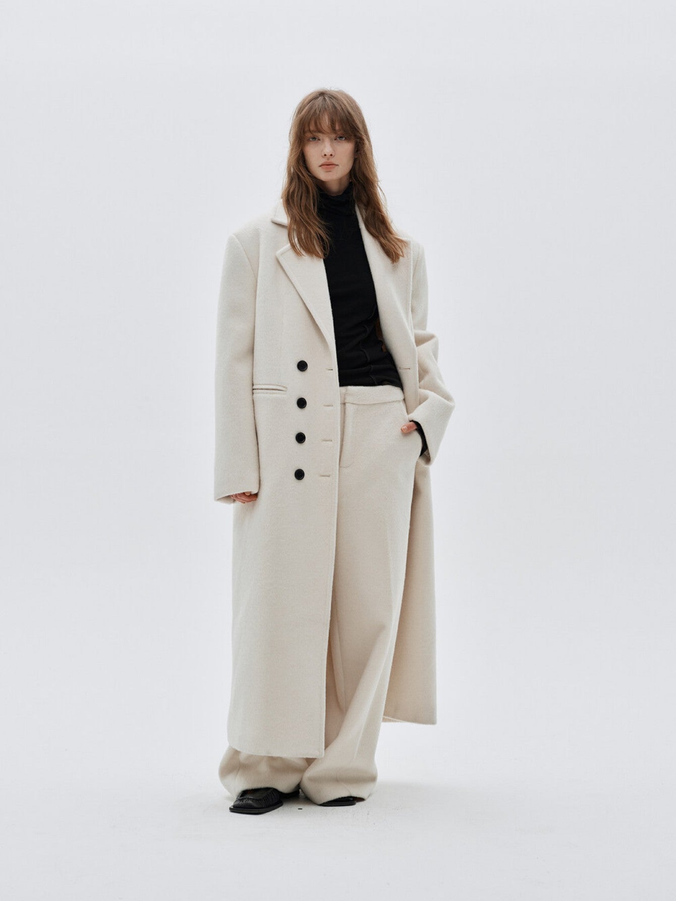 Eliraya double-breasted wool coat for women, featuring a gray long-line design for a classic, tailored winter overcoat look.