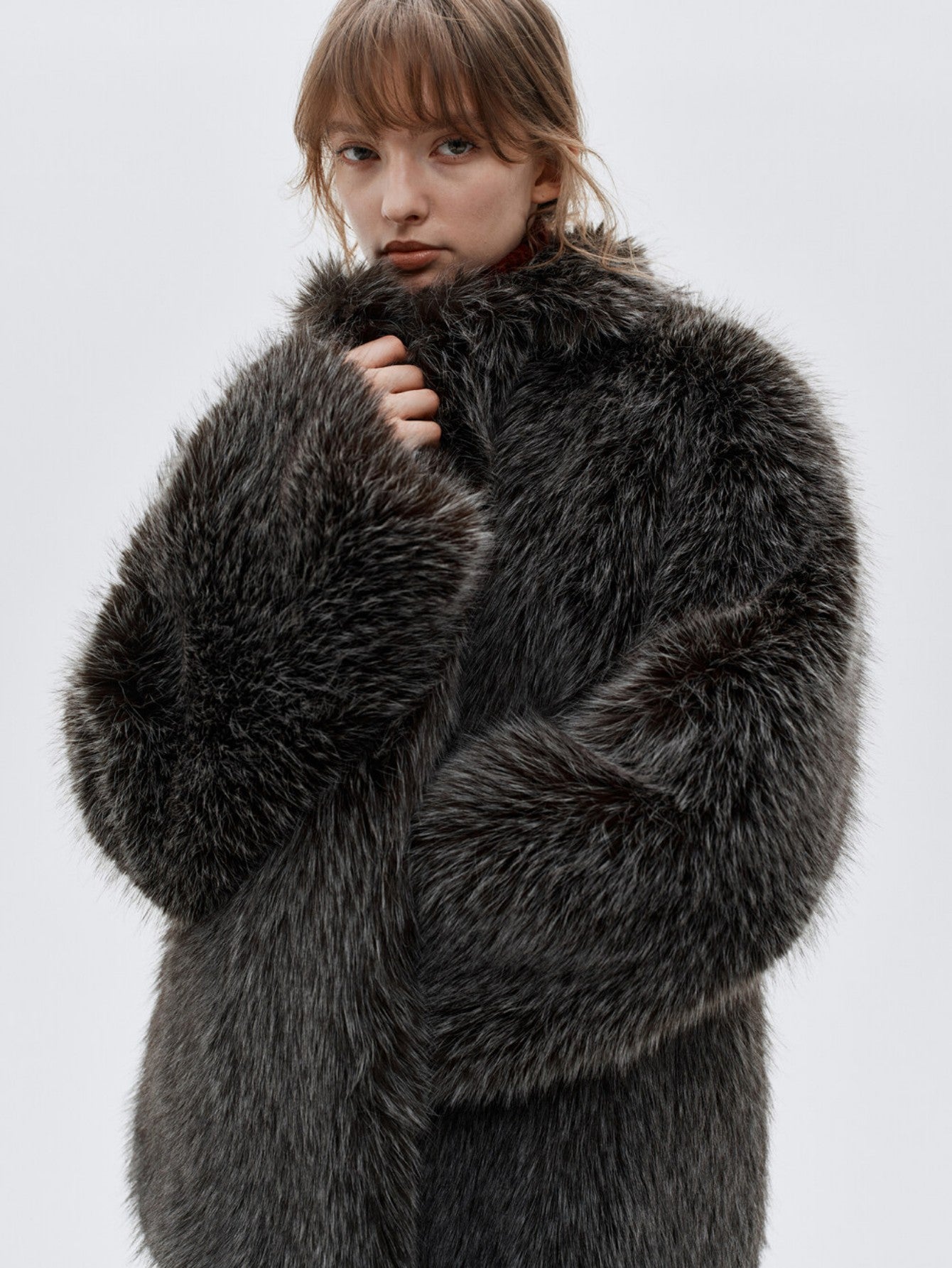 Eliraya faux fur short jacket for women, designed with a high-neck and red fox fur inspiration for a chic winter look.