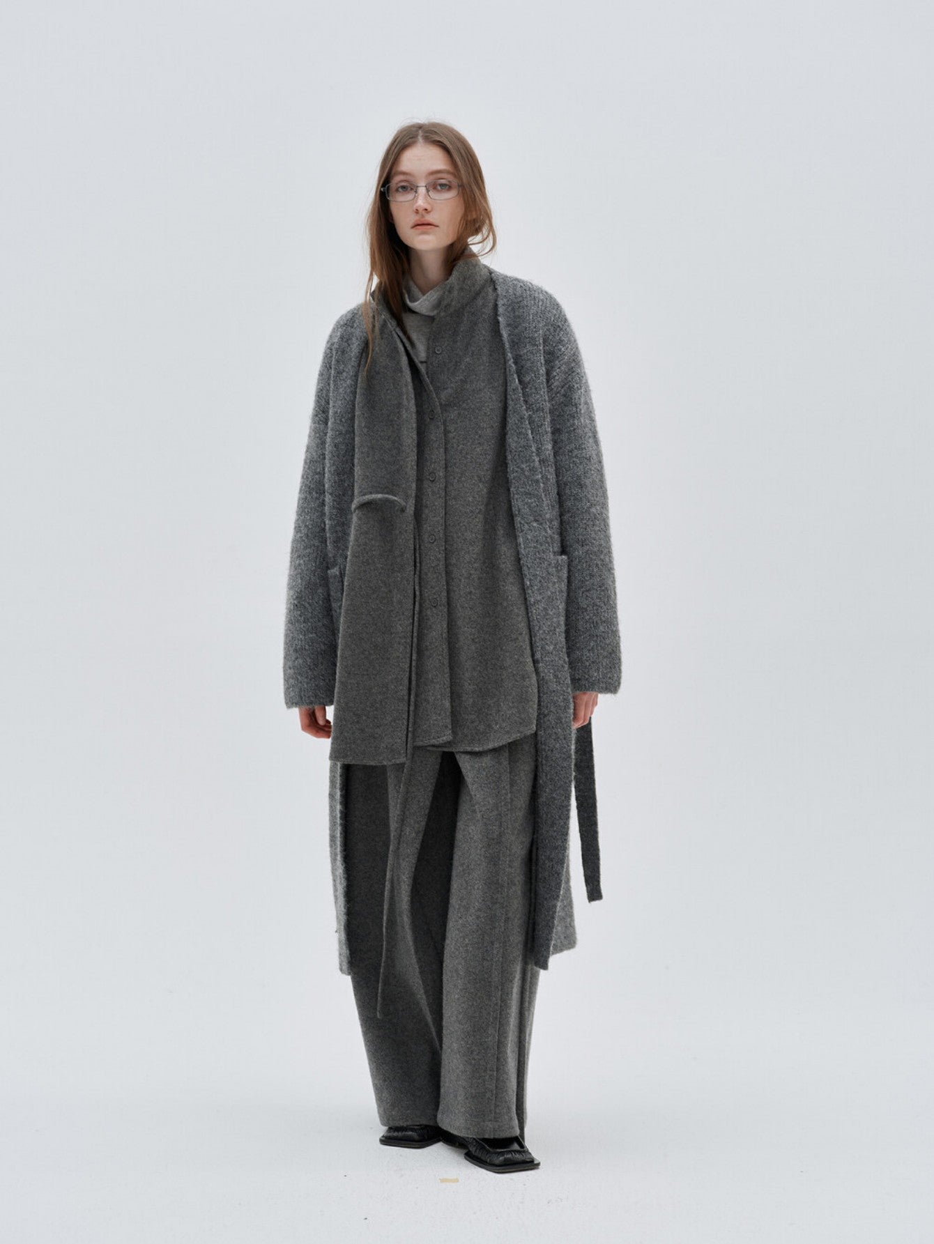 Eliraya French wool overcoat for women, featuring a high-neck and belted design for a warm, sophisticated winter look.