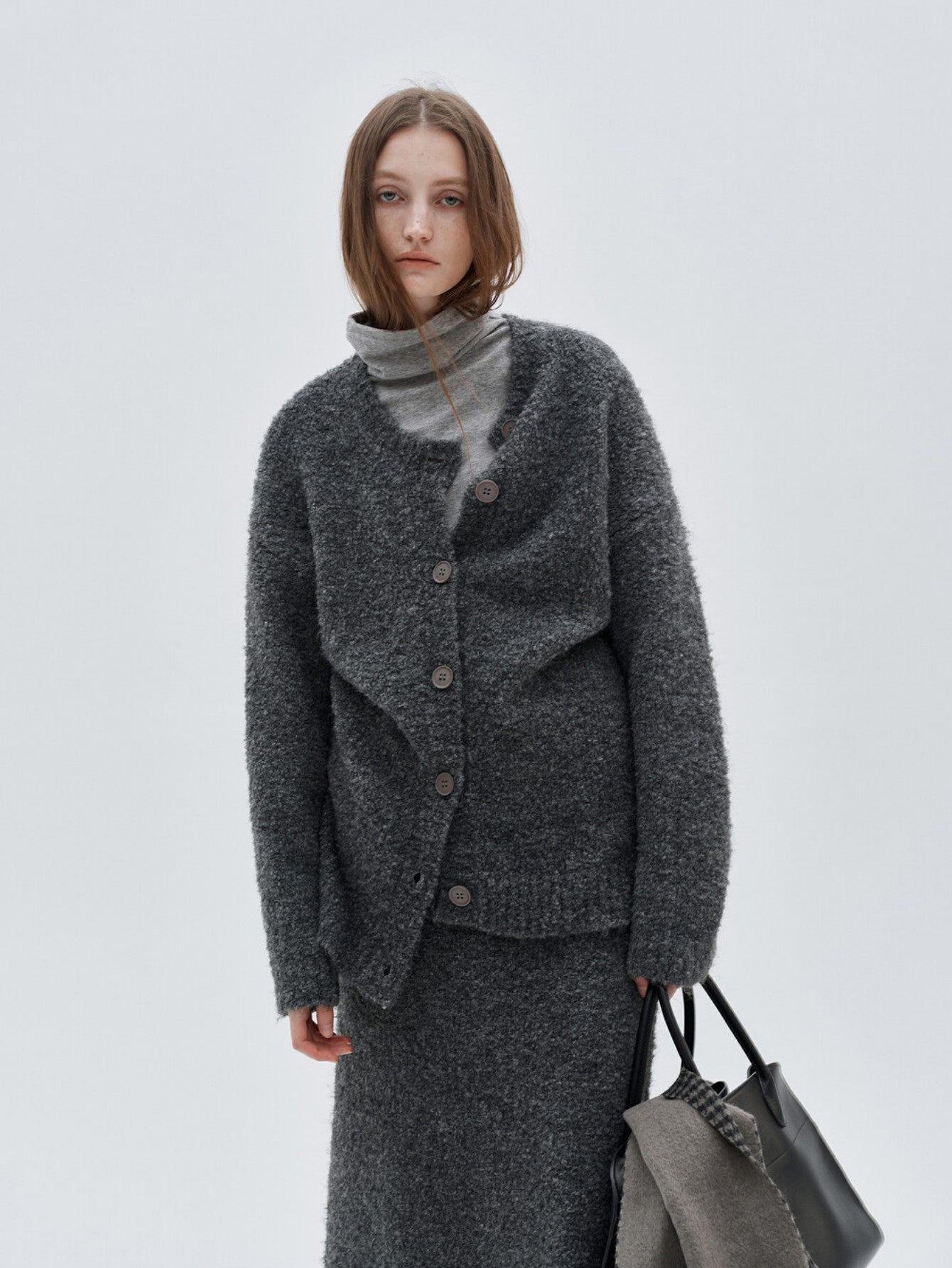 Eliraya French wool overcoat for women, featuring a belted design and high-neck collar for a warm, sophisticated winter look.