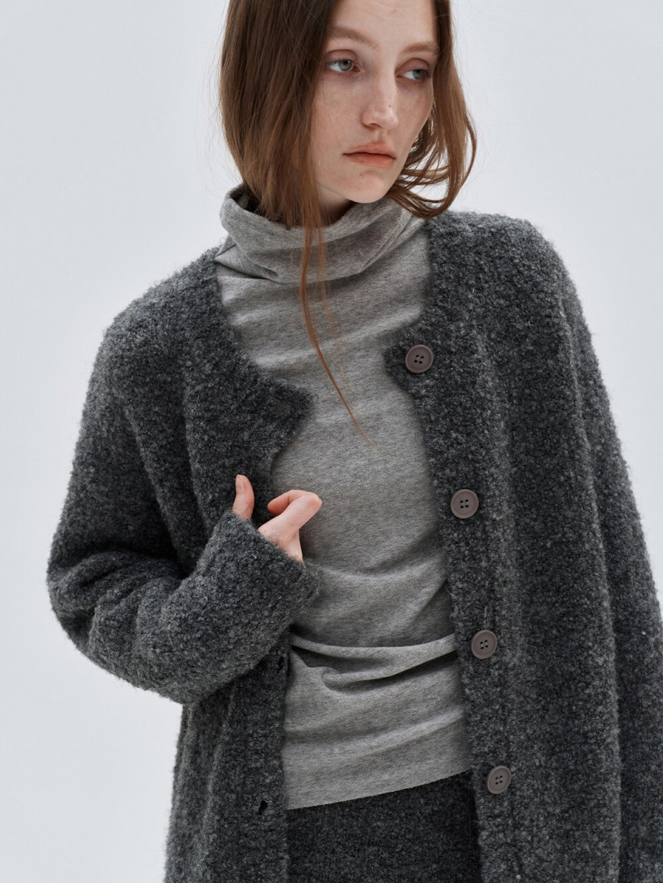 Eliraya French wool overcoat for women, featuring a belted design and high-neck collar for a warm, sophisticated winter look.