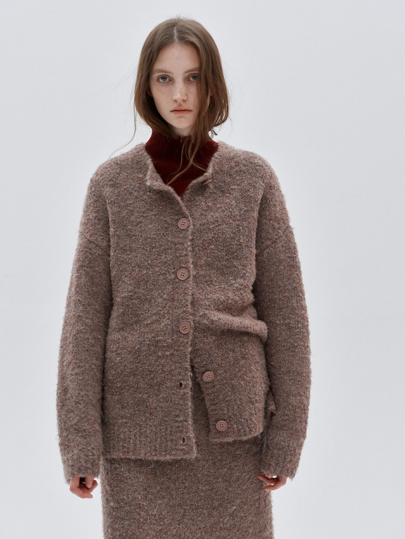 Eliraya French wool overcoat for women, featuring a belted design and high-neck collar for a warm, sophisticated winter look.