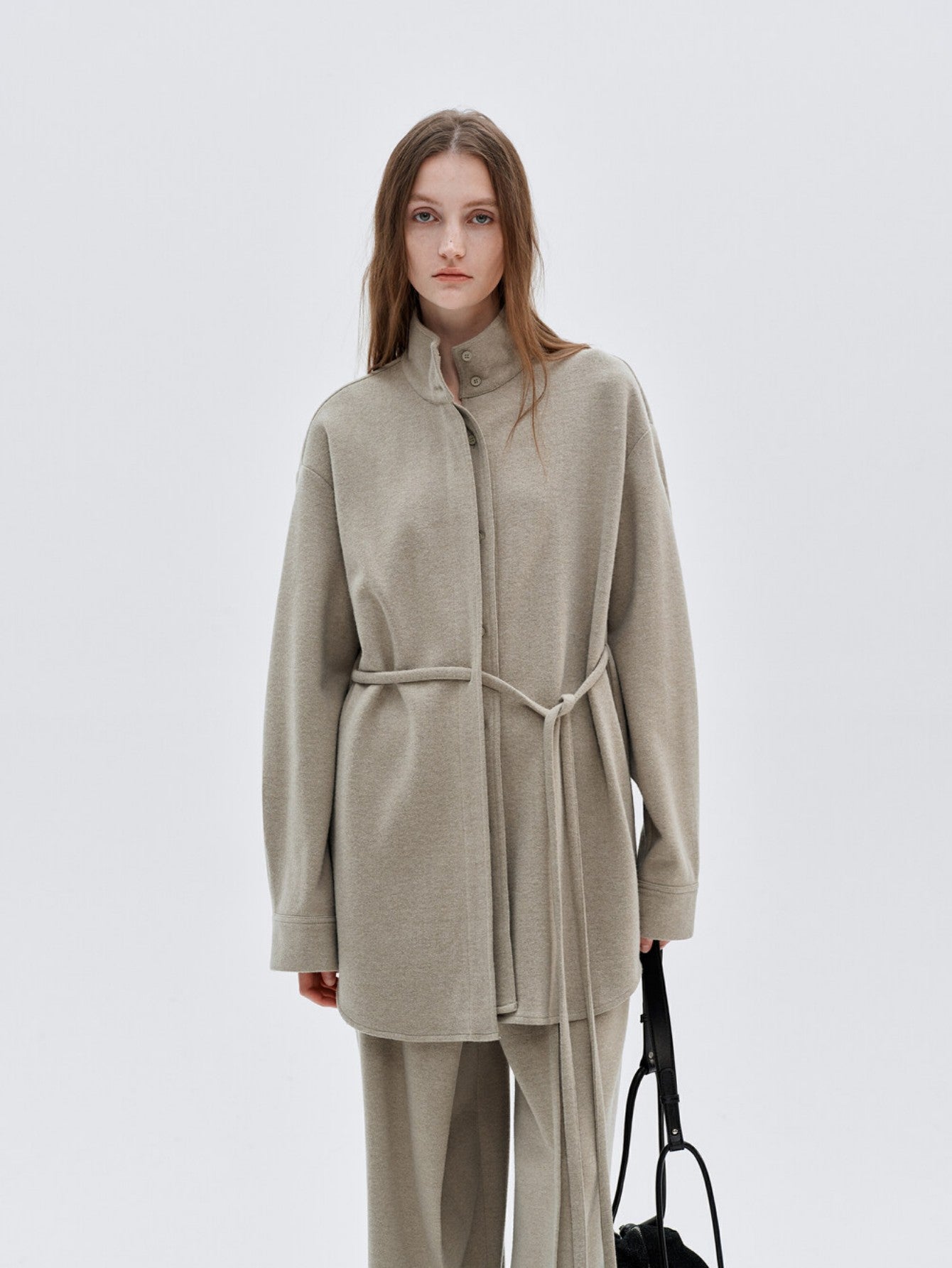 Eliraya French wool overcoat for women, featuring a high-neck and belted design for a warm, sophisticated winter look.