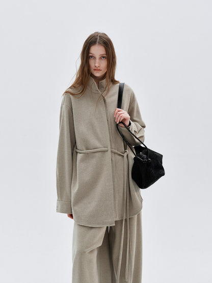 Eliraya French wool overcoat for women, featuring a high-neck and belted design for a warm, sophisticated winter look.