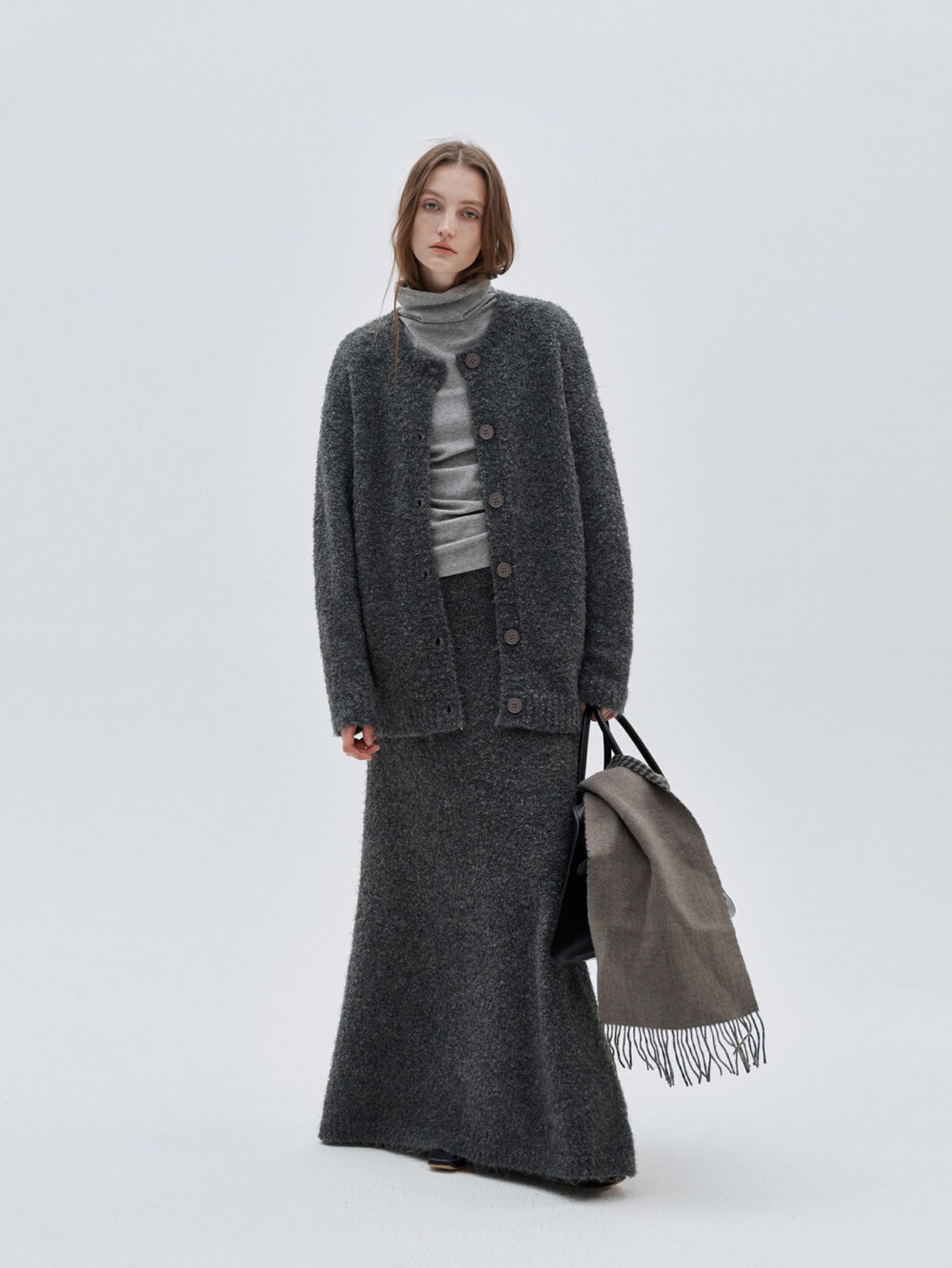 Eliraya gray wool fish tail maxi skirt for women, designed with a fitted waist and flare for an elegant winter silhouette.