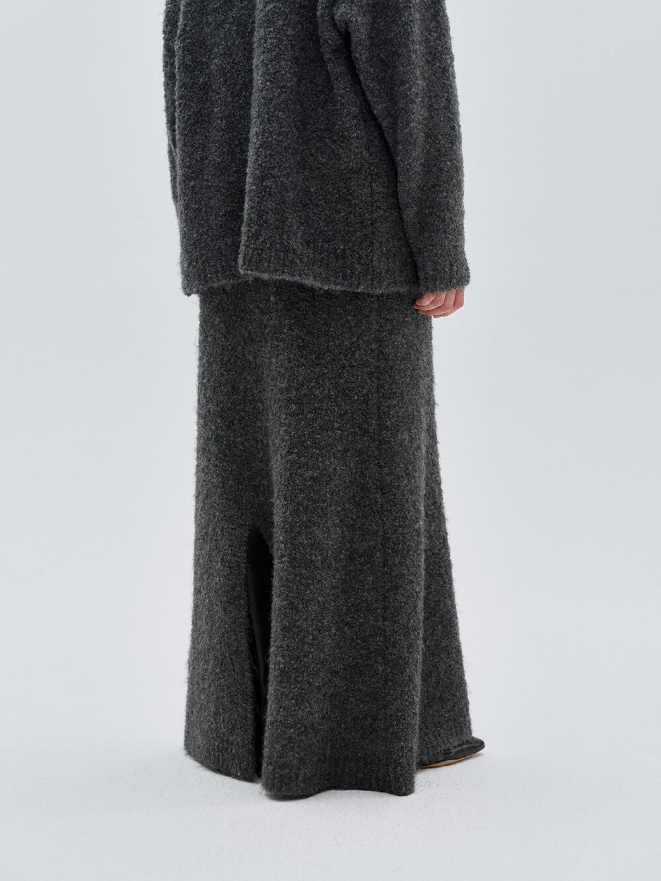 Eliraya gray wool fish tail maxi skirt for women, designed with a fitted waist and flare for an elegant winter silhouette.