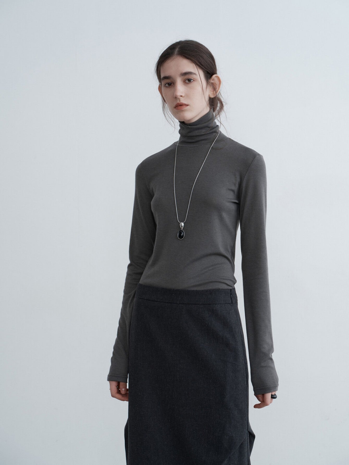 Eliraya slim-fit high-neck cowl sweater for women, featuring ruffle details and a flattering fit, ideal for autumn layering.