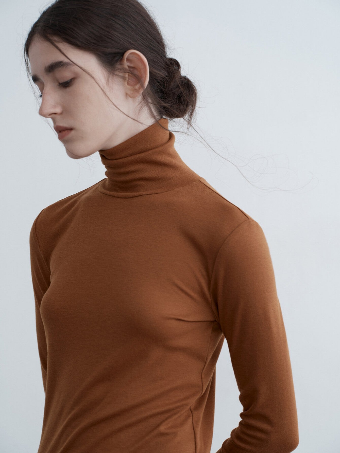 Eliraya slim-fit high-neck cowl sweater for women, featuring ruffle details and a flattering fit, ideal for autumn layering.