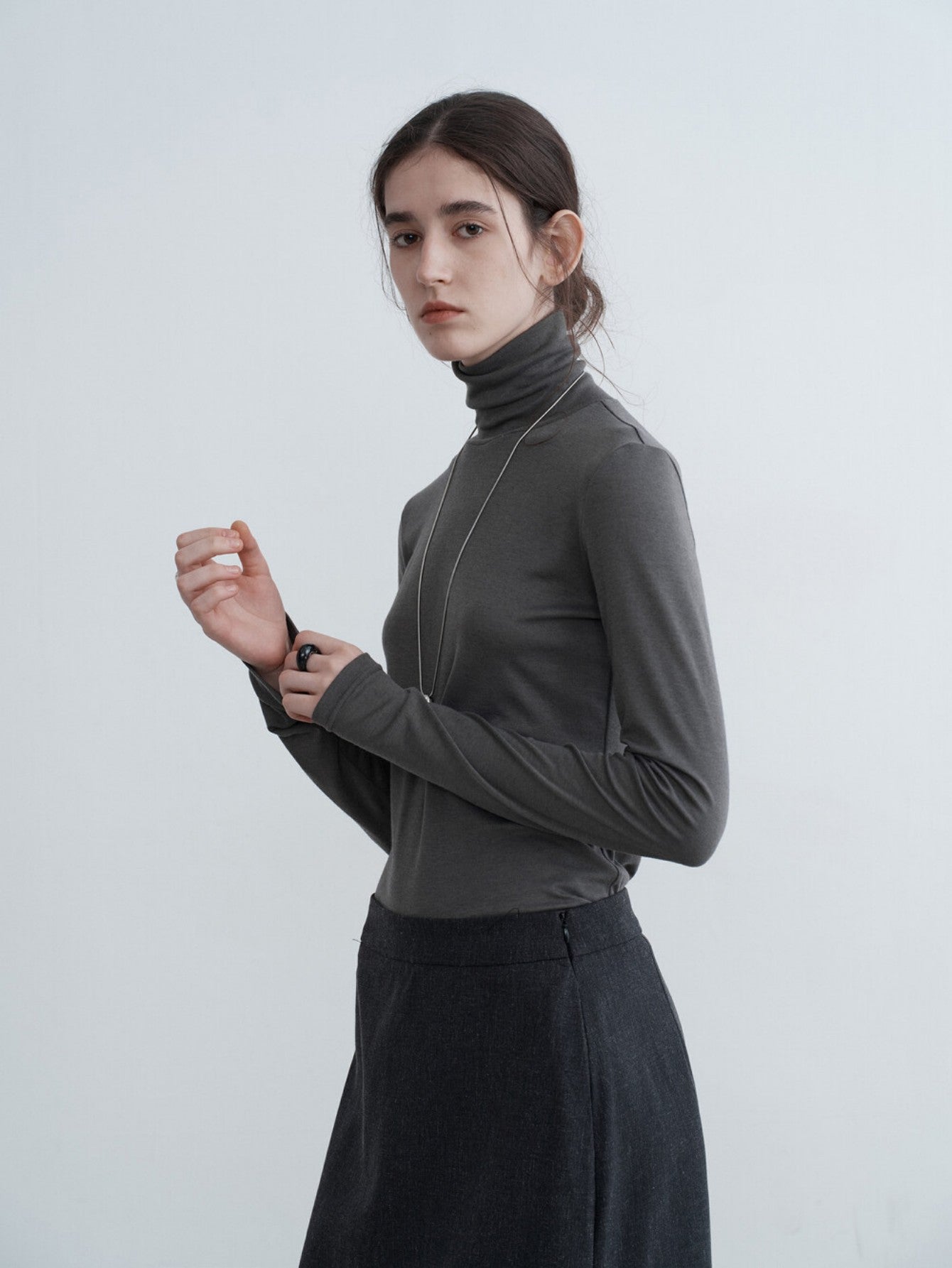 Eliraya slim-fit high-neck cowl sweater for women, featuring ruffle details and a flattering fit, ideal for autumn layering.