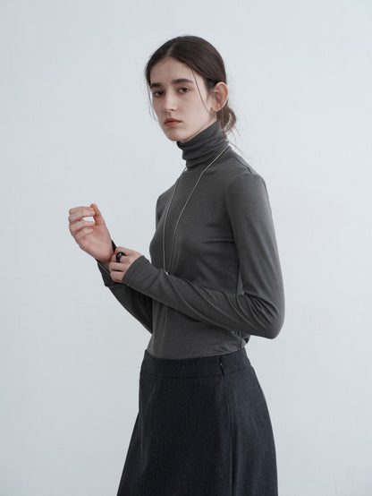 Eliraya slim-fit high-neck cowl sweater for women, featuring ruffle details and a flattering fit, ideal for autumn layering.