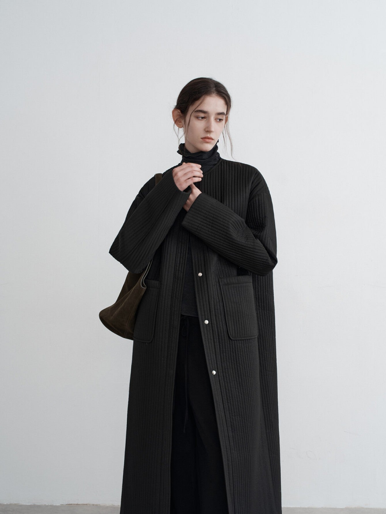 Eliraya oversized long puffer coat for women, featuring a loose fit and over-knee length, perfect for winter warmth and stylish comfort.