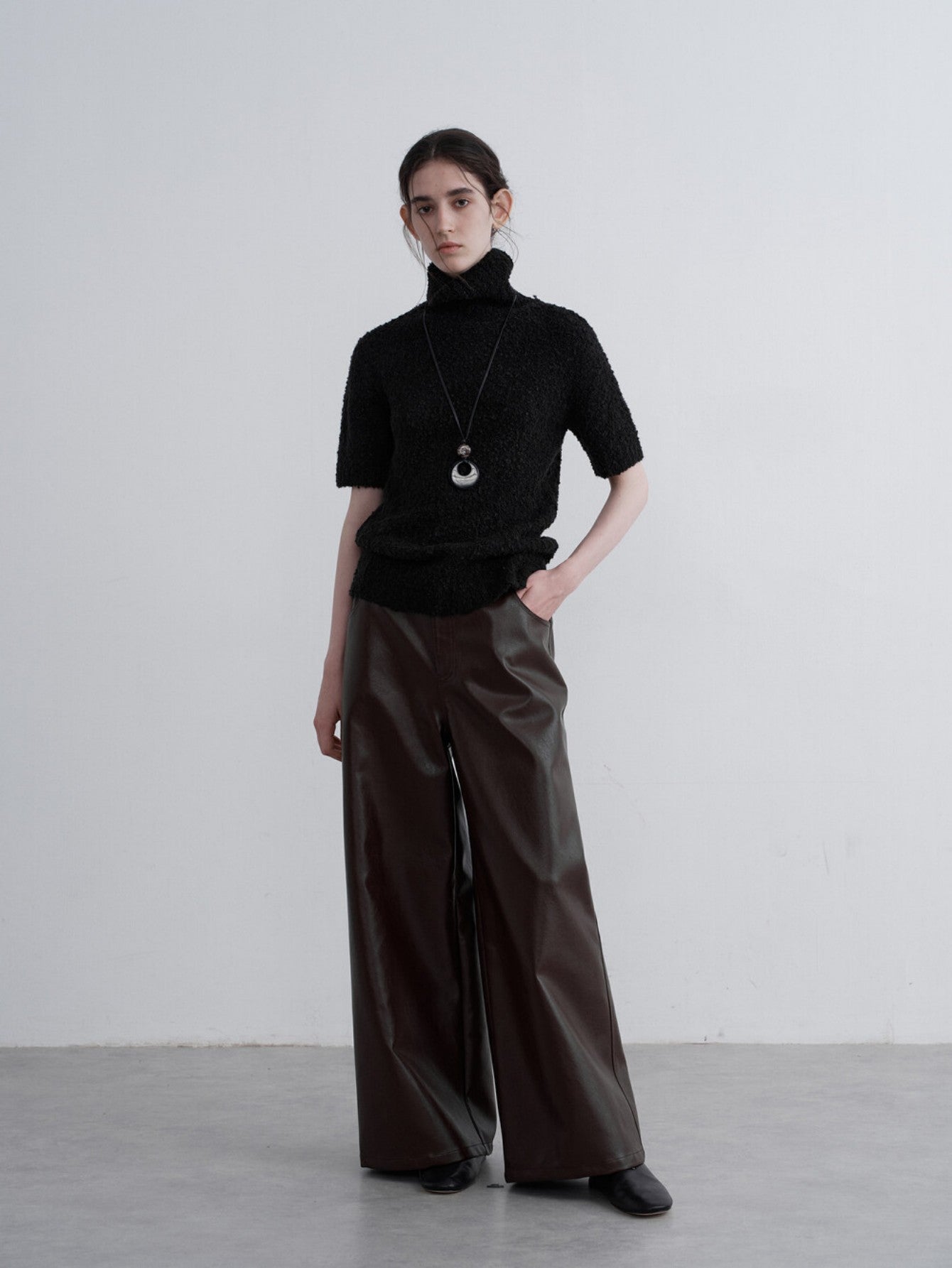 Eliraya retro PU leather pants for women, featuring a vintage straight-leg design and wide-leg fit for a stylish American-style look.