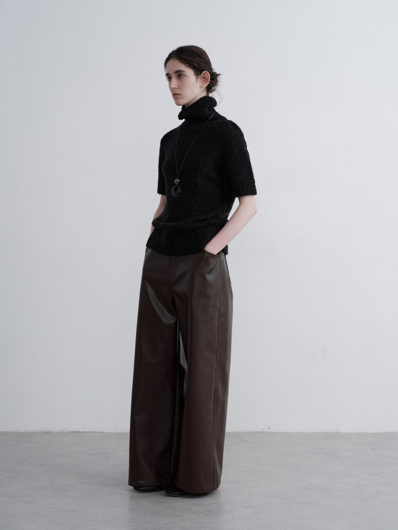 Eliraya retro PU leather pants for women, featuring a vintage straight-leg design and wide-leg fit for a stylish American-style look.