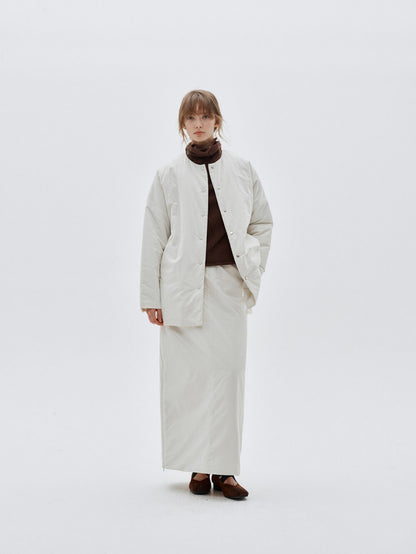 Eliraya white split-hem maxi skirt for women, designed with a quilted texture for warmth and elegance during winter.