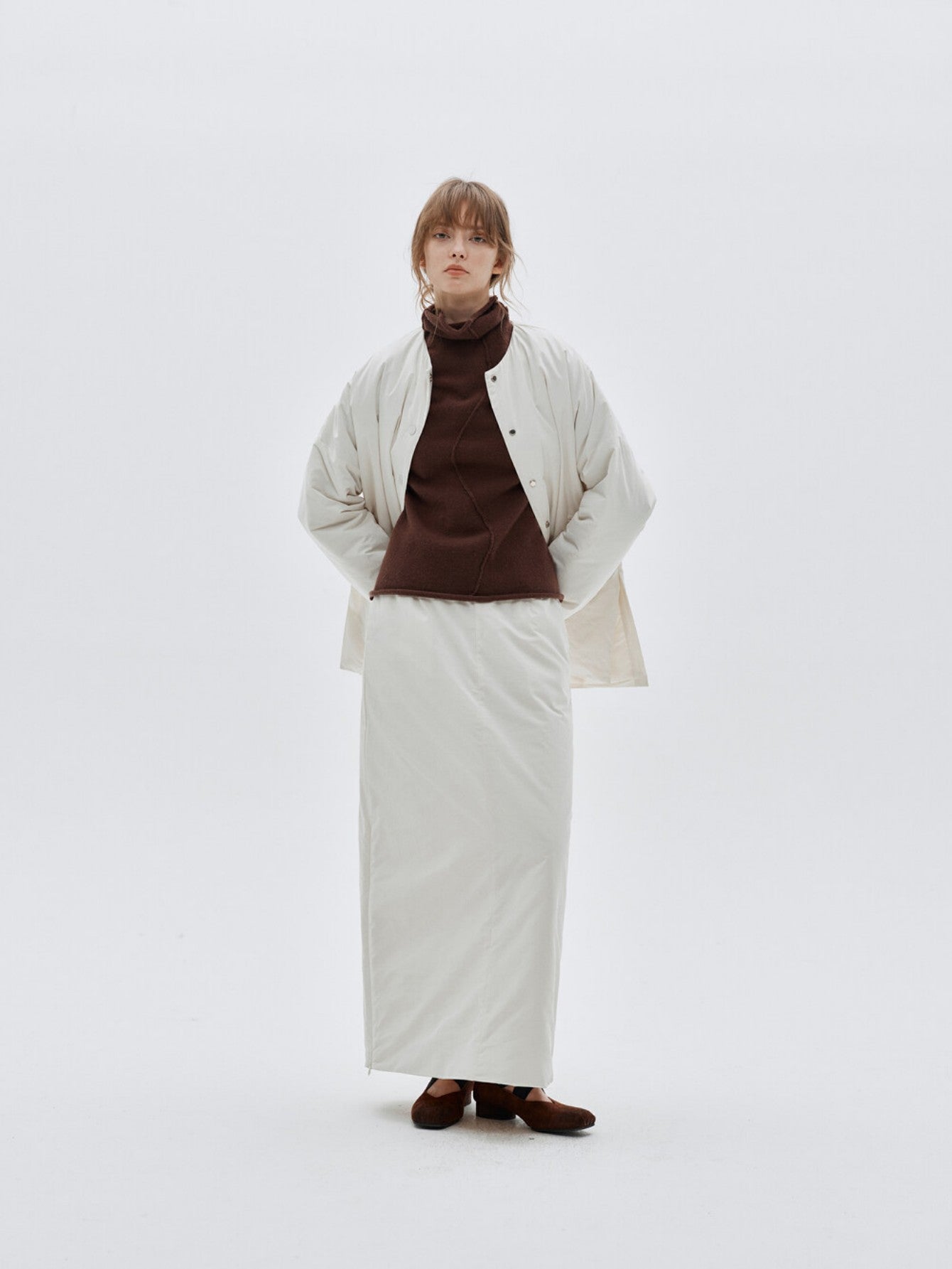 Eliraya white split-hem maxi skirt for women, designed with a quilted texture for warmth and elegance during winter.