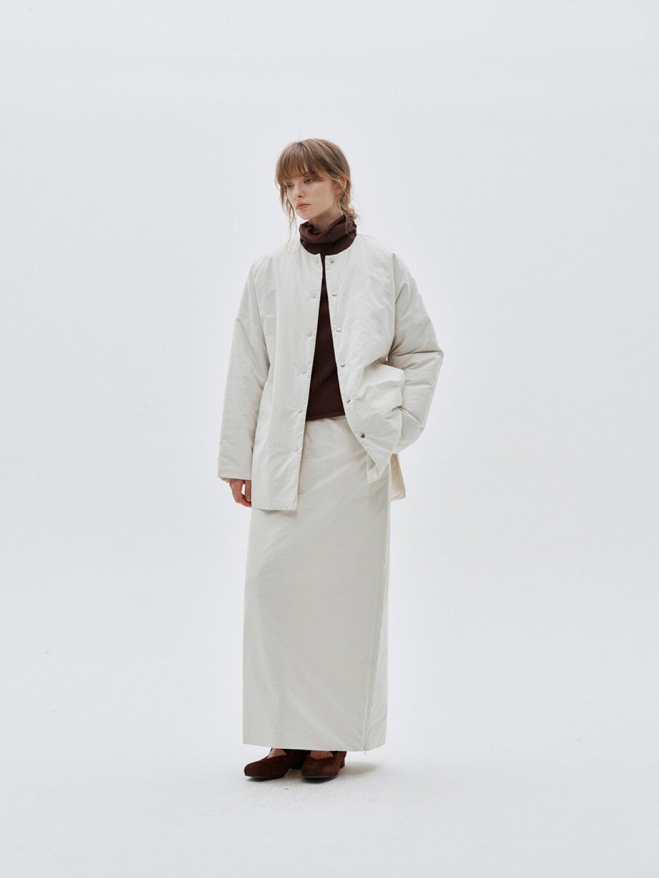 Eliraya white split-hem maxi skirt for women, designed with a quilted texture for warmth and elegance during winter.