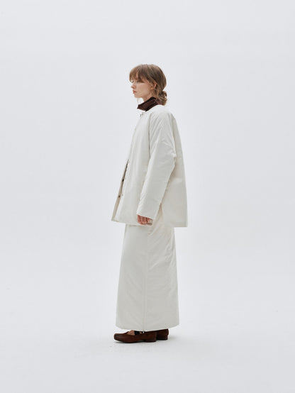 Eliraya white split-hem maxi skirt for women, designed with a quilted texture for warmth and elegance during winter.