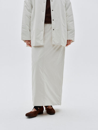 Eliraya white split-hem maxi skirt for women, designed with a quilted texture for warmth and elegance during winter.