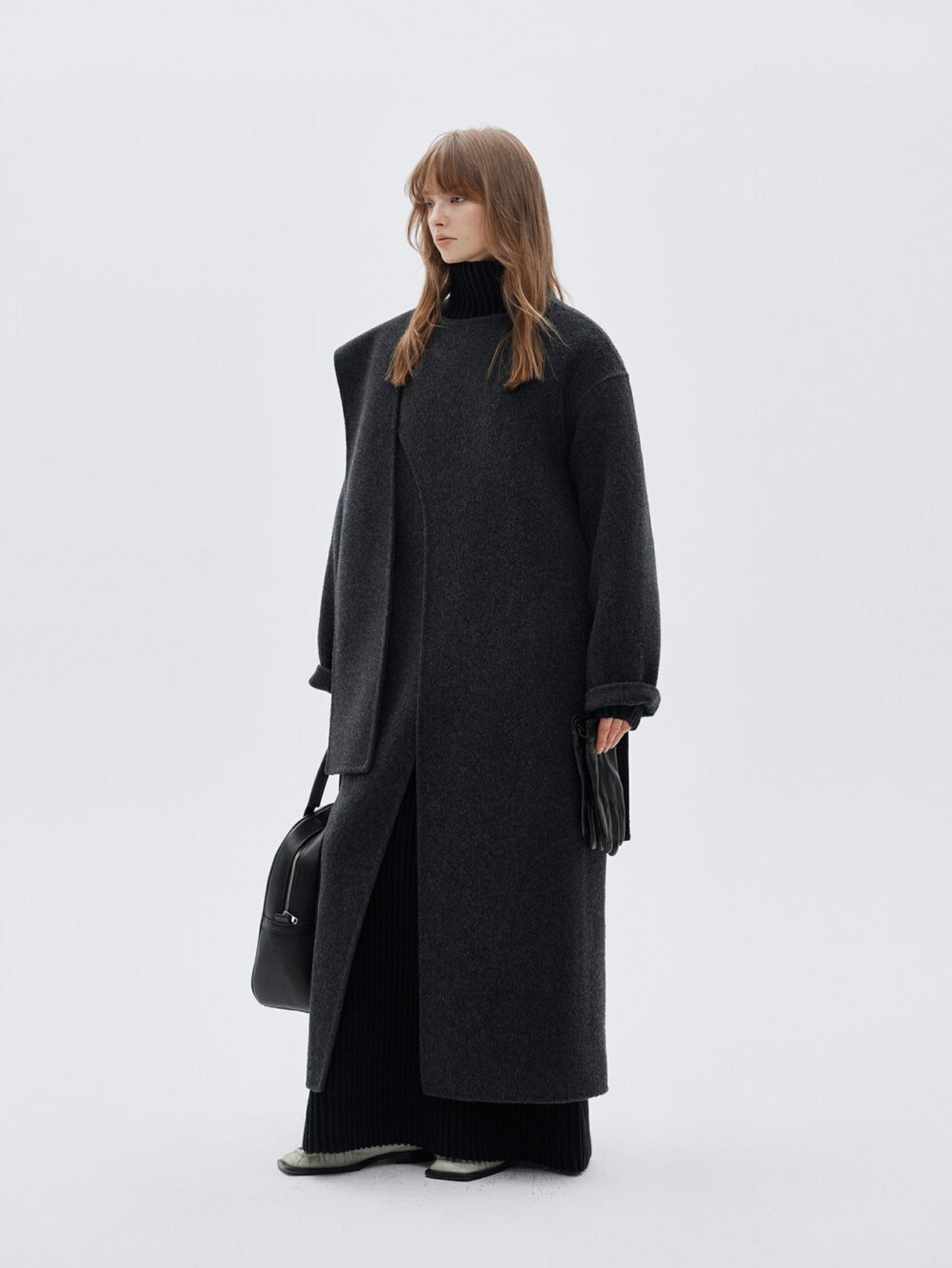 Eliraya wool scarf coat for women, designed with a double-sided wool fabric and a belt, perfect for winter warmth and elegant styling.