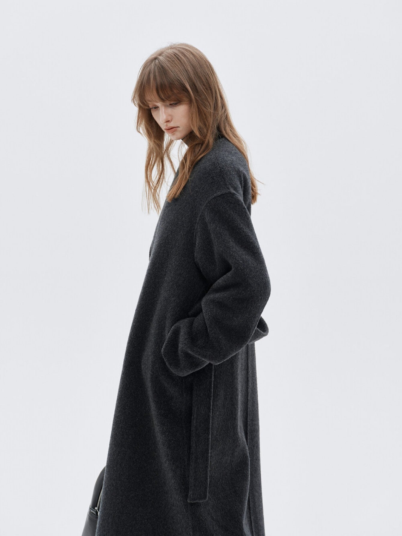 Eliraya wool scarf coat for women, designed with a double-sided wool fabric and a belt, perfect for winter warmth and elegant styling.